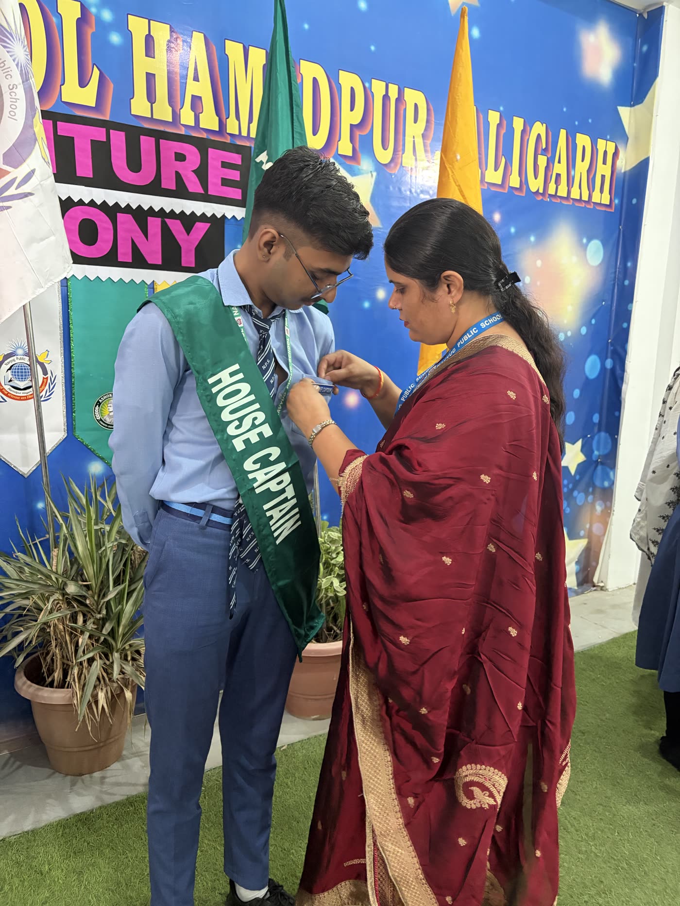 Principal Pinning the House Captain Badge